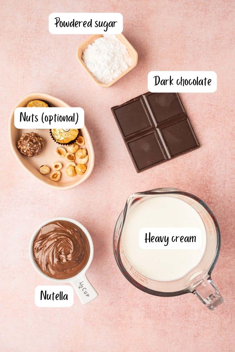 Ingredients needed for nutella chocolate mousse being laid out on a pink background.