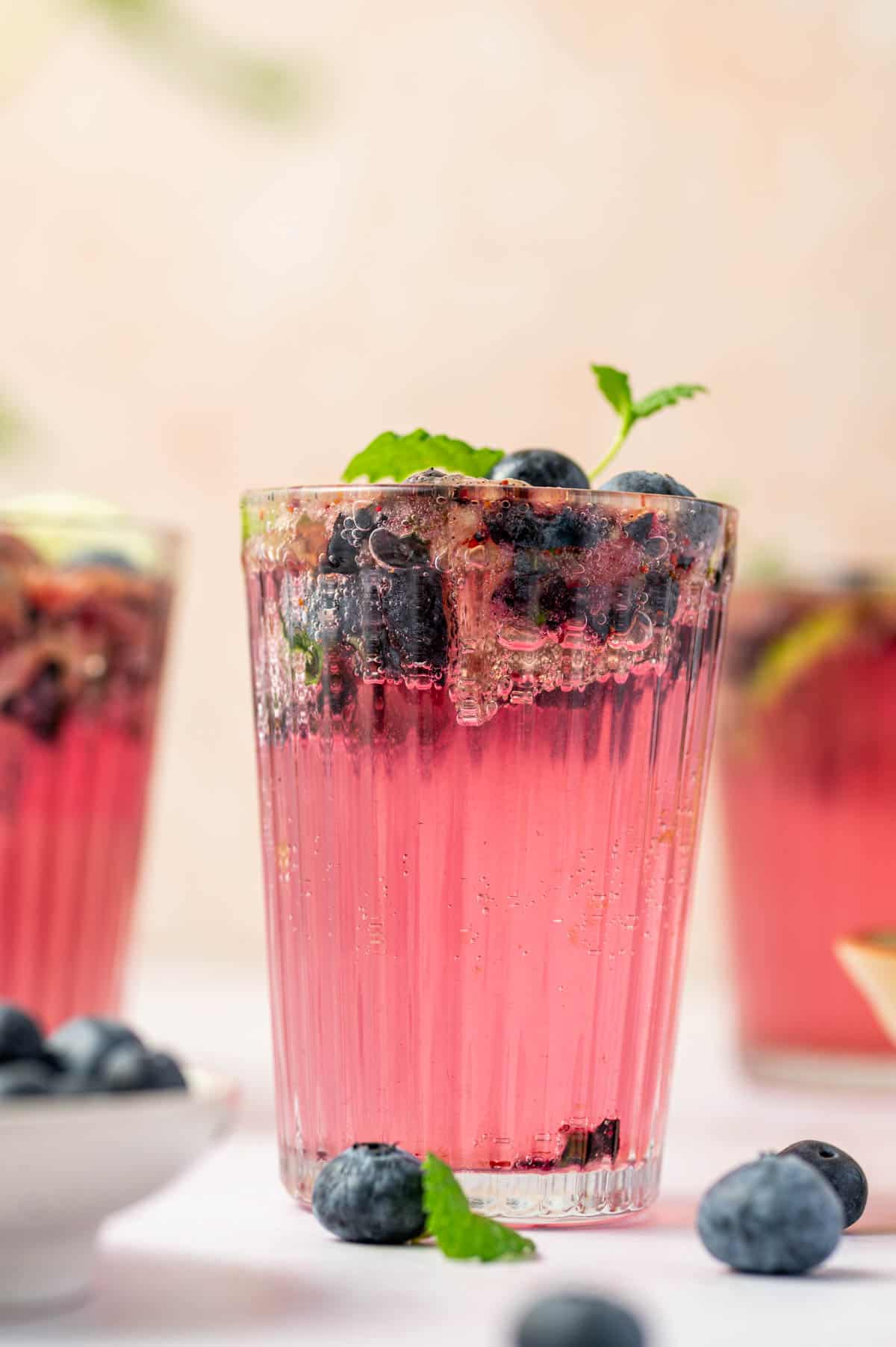 Refreshing blueberry mojito mocktail with fresh mint and lime in a glass