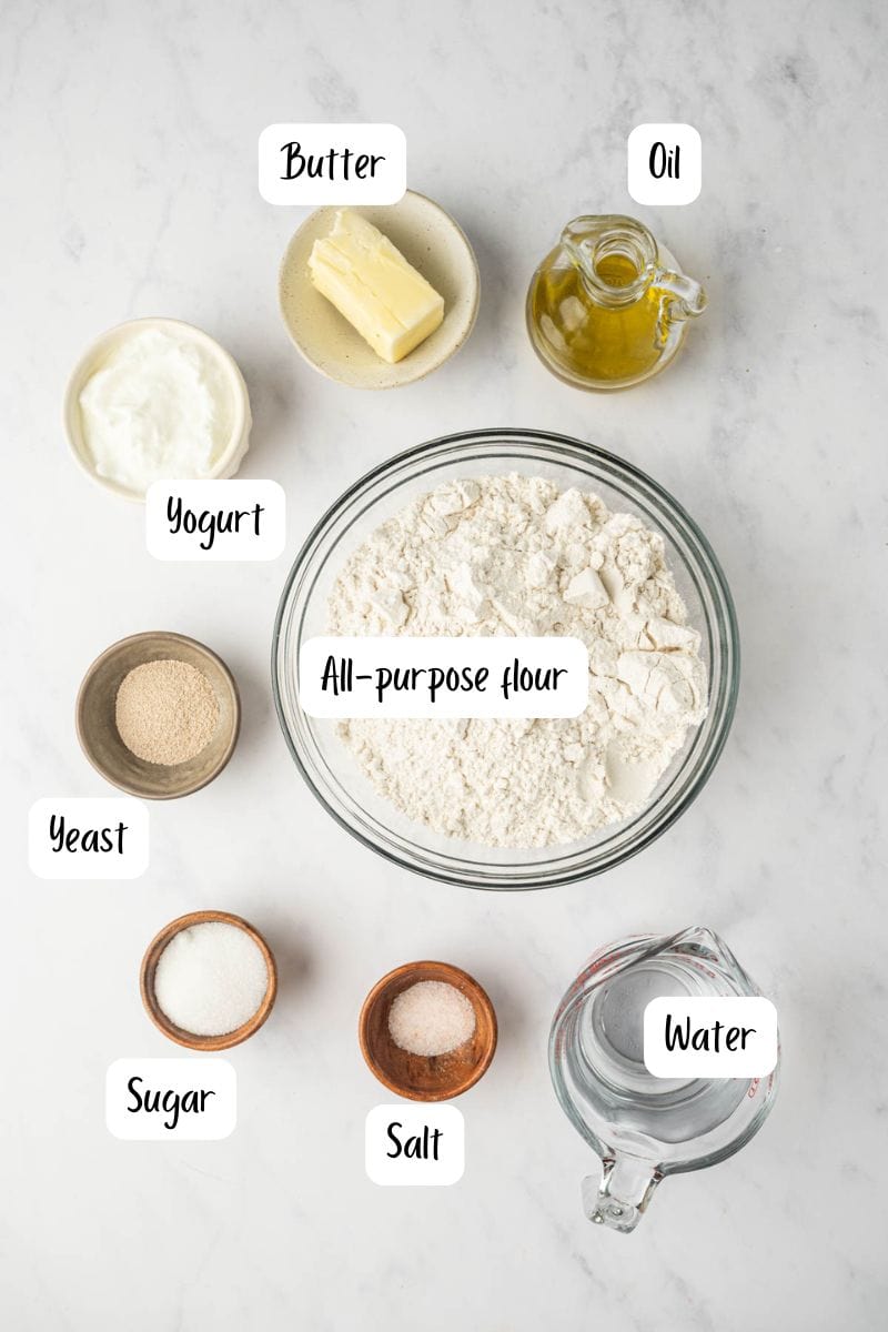 Ingredients laid out for making Indian Naan bread recipe from the scratch.