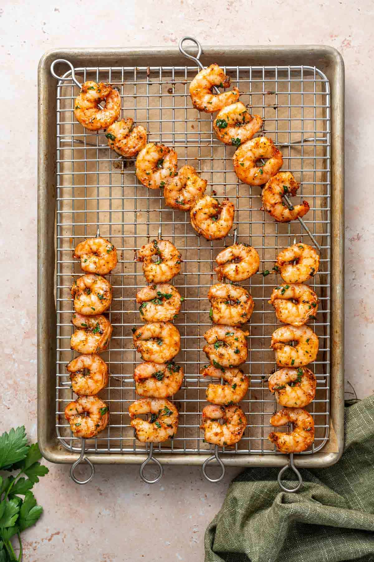 Shrimp skewers are just out from the oven and cooling in the wire rack.