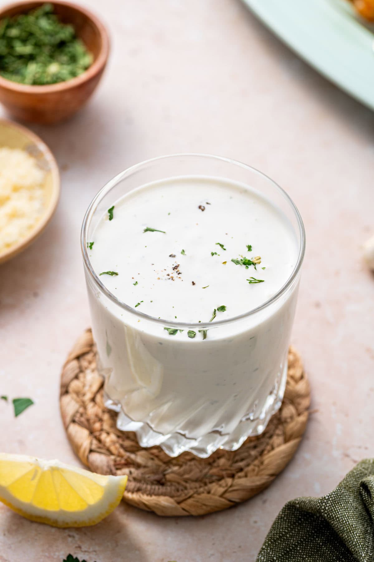 Easy ranch dip with parmesan cheese and garlic placed in a glass jar, perfect for veggies or wings.