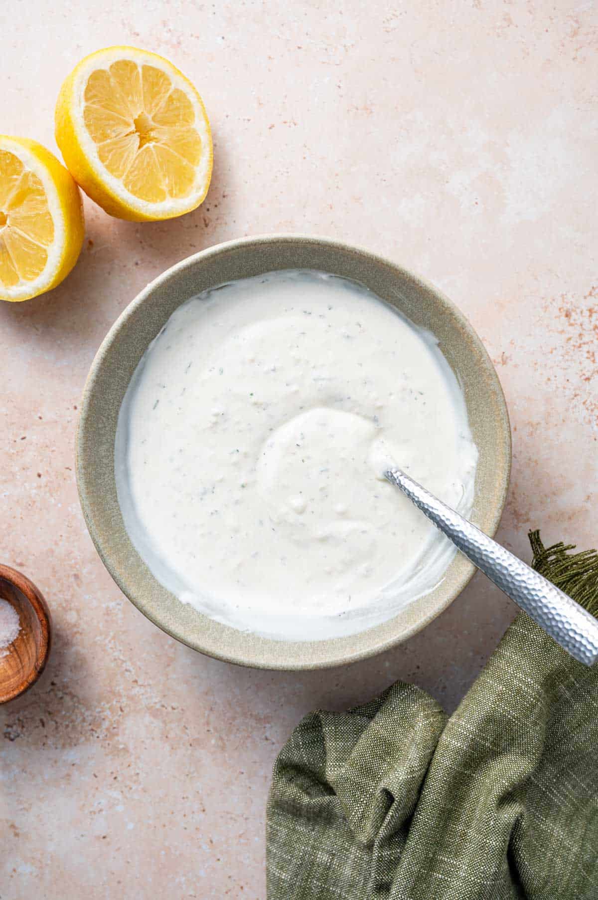 Parmesan ranch dip in a bowl with a spoon.