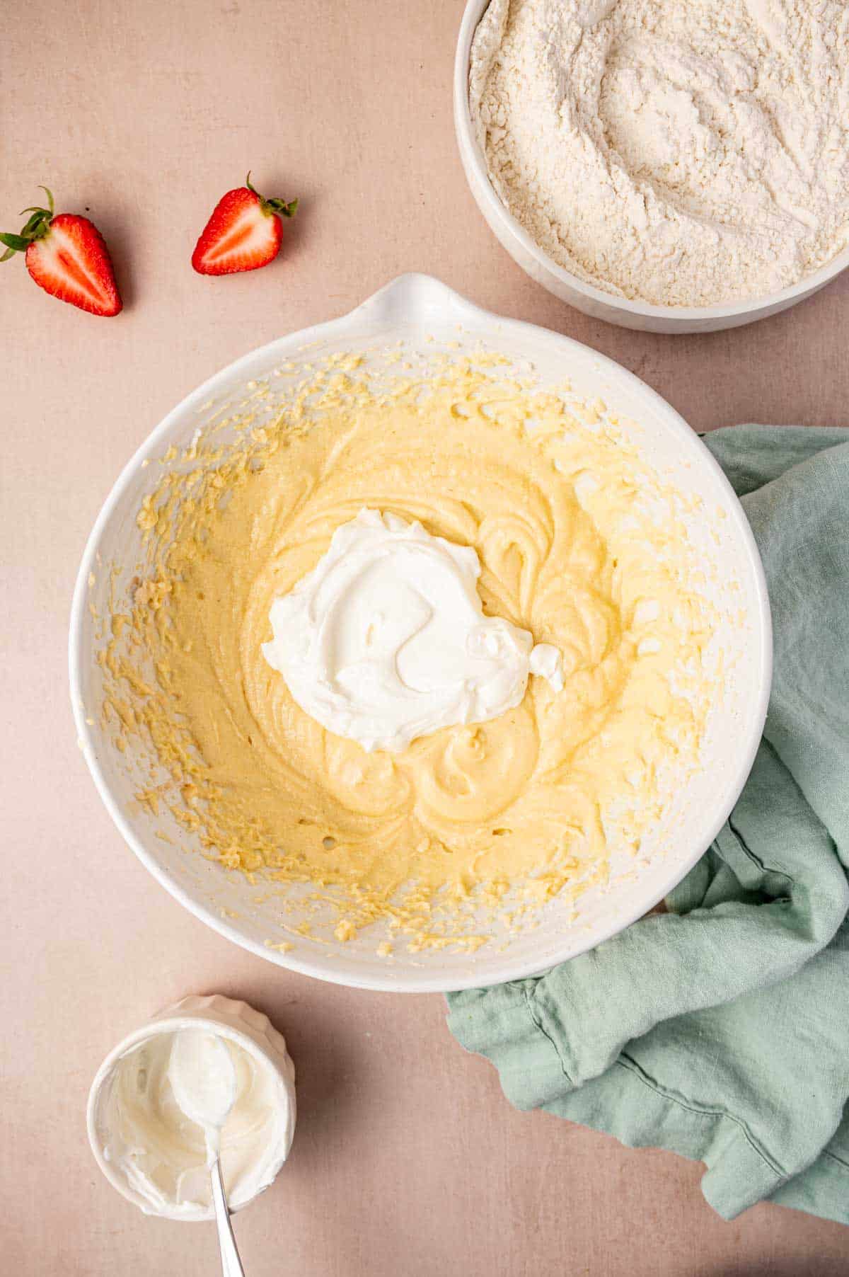 In a large bowl butter and sugar are creamed and sour cream is added.