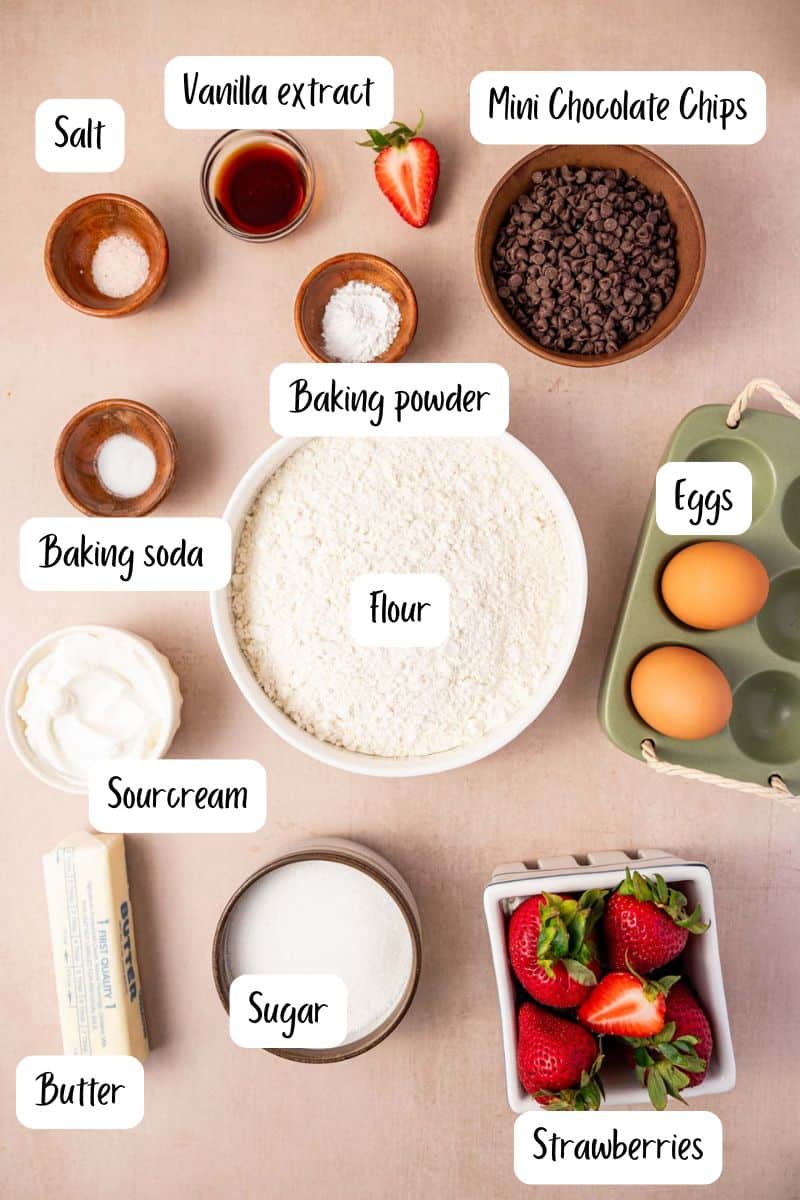 Ingredients laid out for making strawberry chocolate chip muffins.