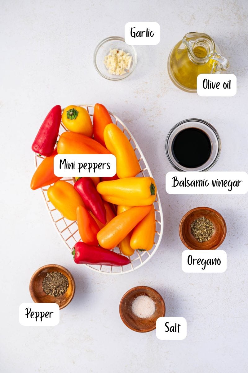 Ingredients being laid out for roasting mini sweet peppers in oven.