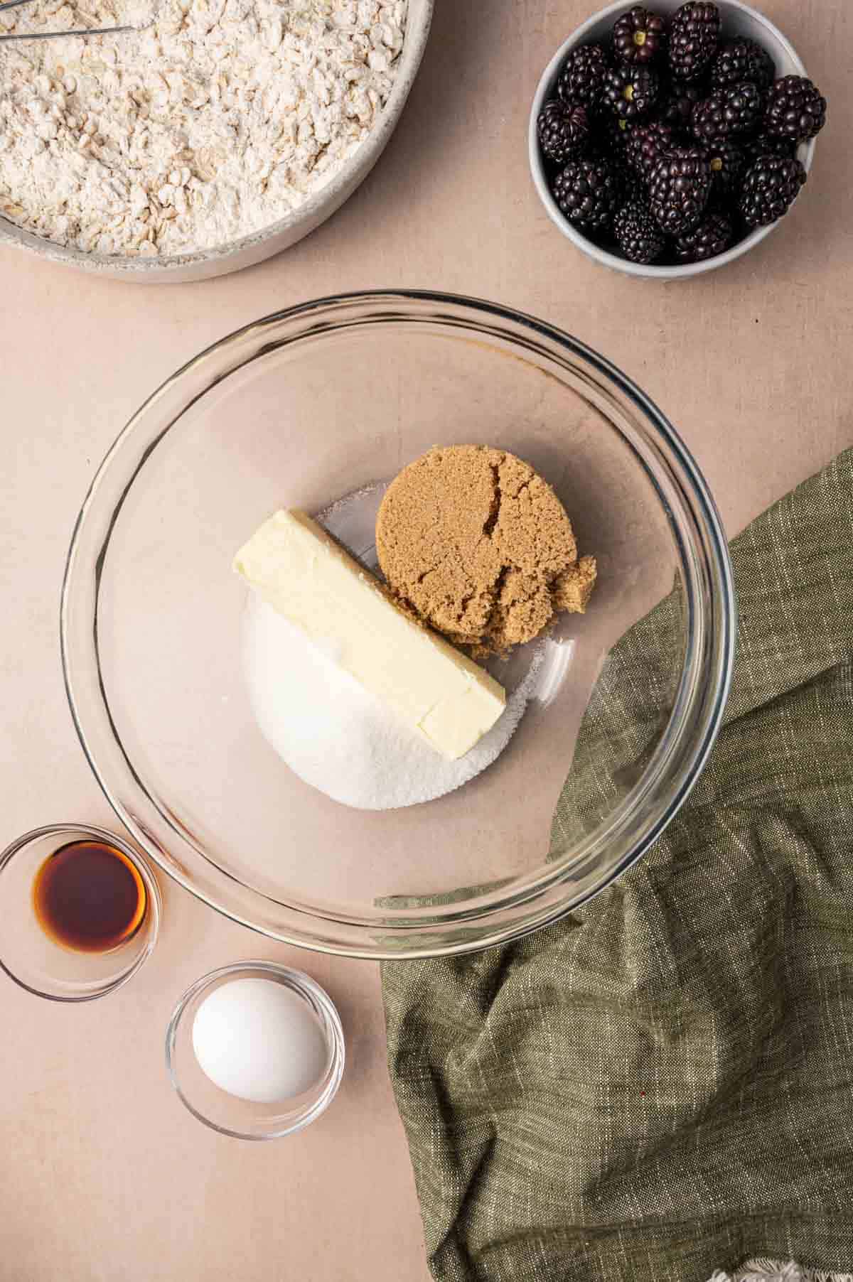 In a bowl butter, brown sugar and white sugar is ready for mixing.