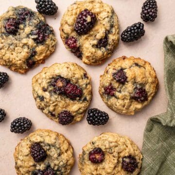 Overhead shot of homemade blackberry oatmeal cookies with fresh berries