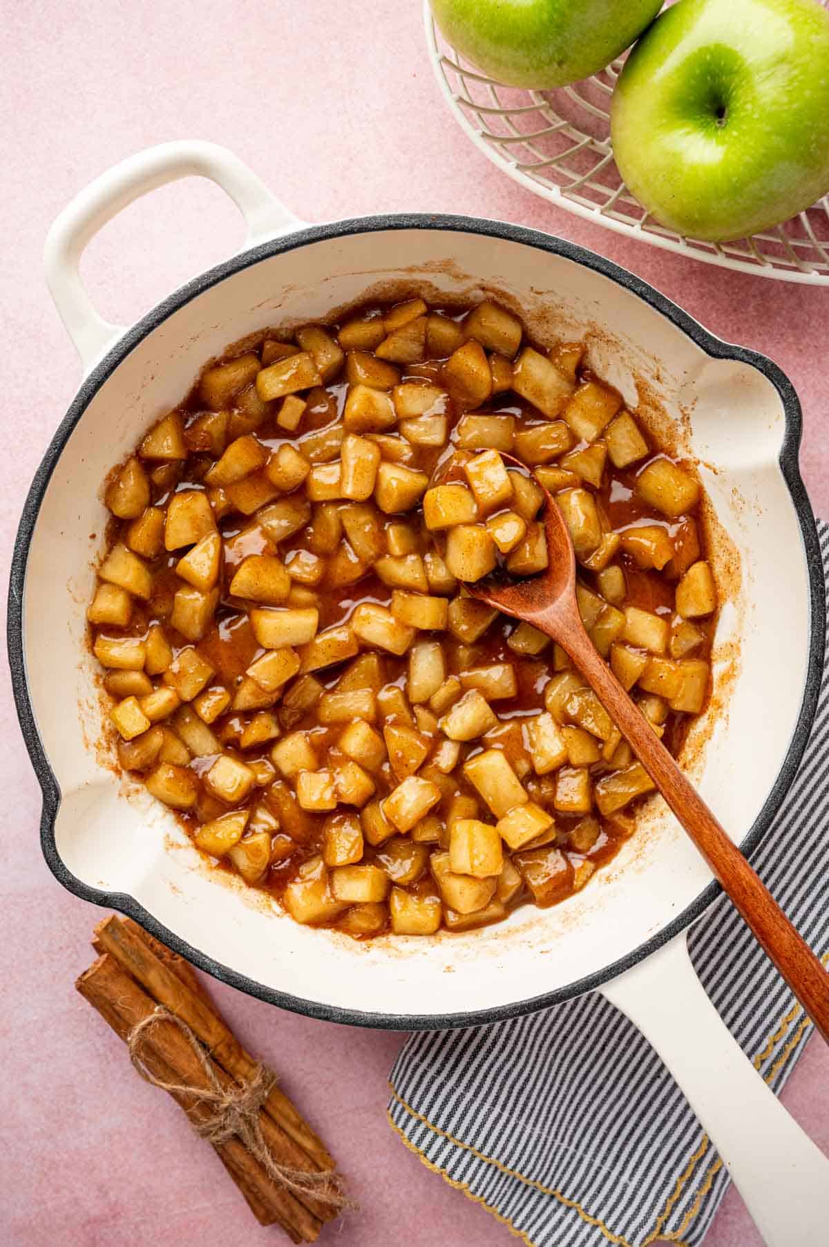 Cinnamon apple pie filling is ready in a skillet.