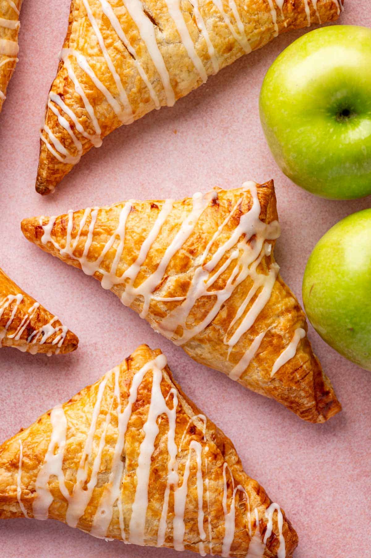 Homemade apple turnovers with puff pastry layers and spiced apple filling.