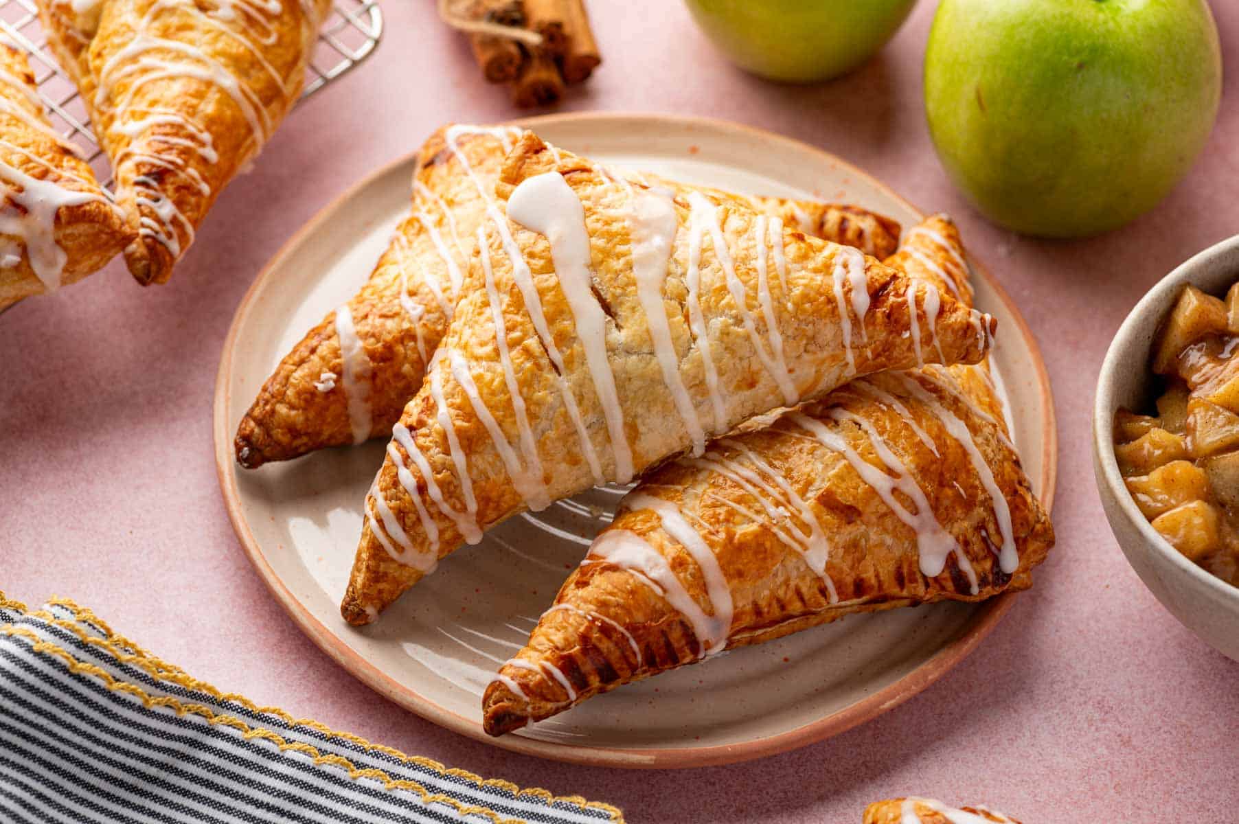 Easy puff pastry turnovers with sweet apple filling and golden crust.