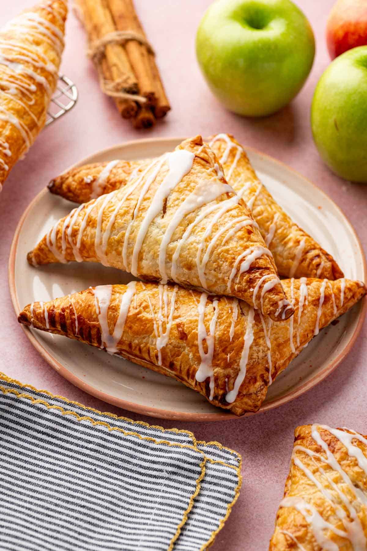 Baked apple turnovers with puff pastry served for dessert.