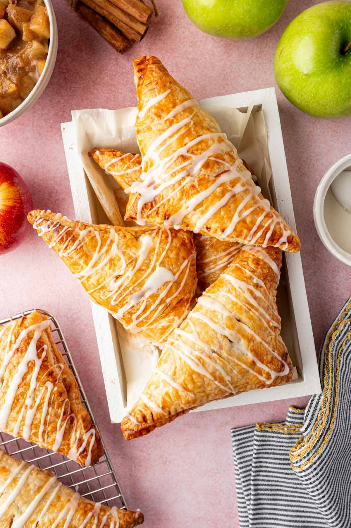 Freshly baked apple turnovers with crisp pastry and caramelized apple chunks.