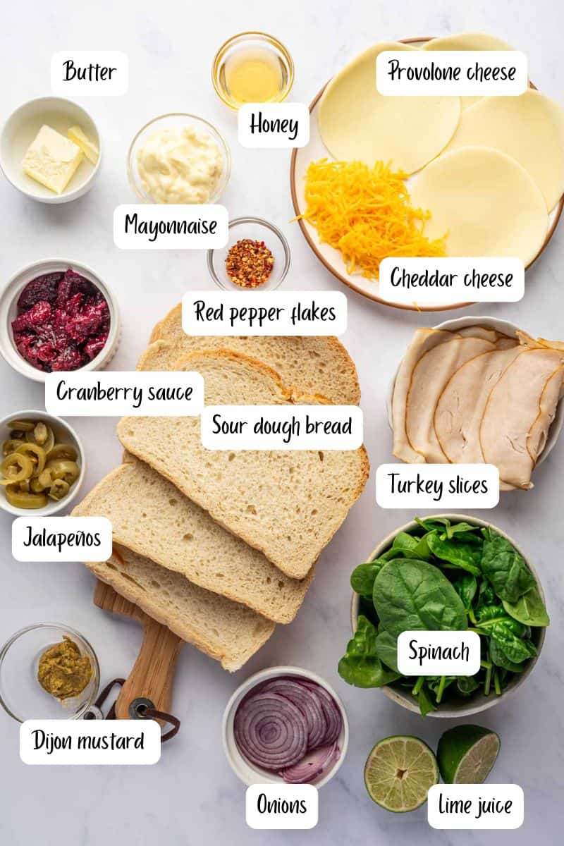 Ingredients being laid out for making turkey melt sandwich recipe.