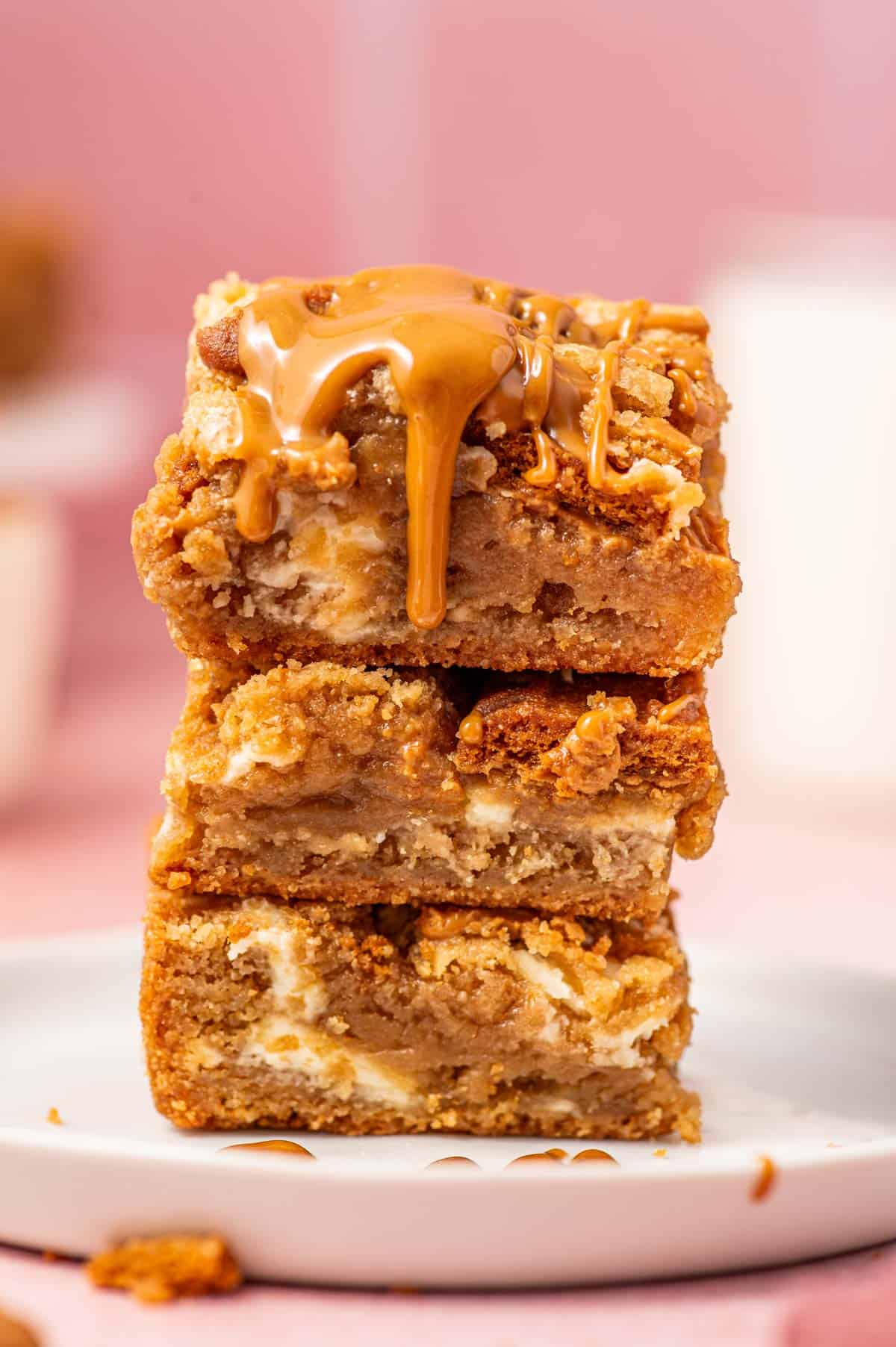 Squares of biscoff blondies with a gooey texture and bits of crunchy biscoff cookies.