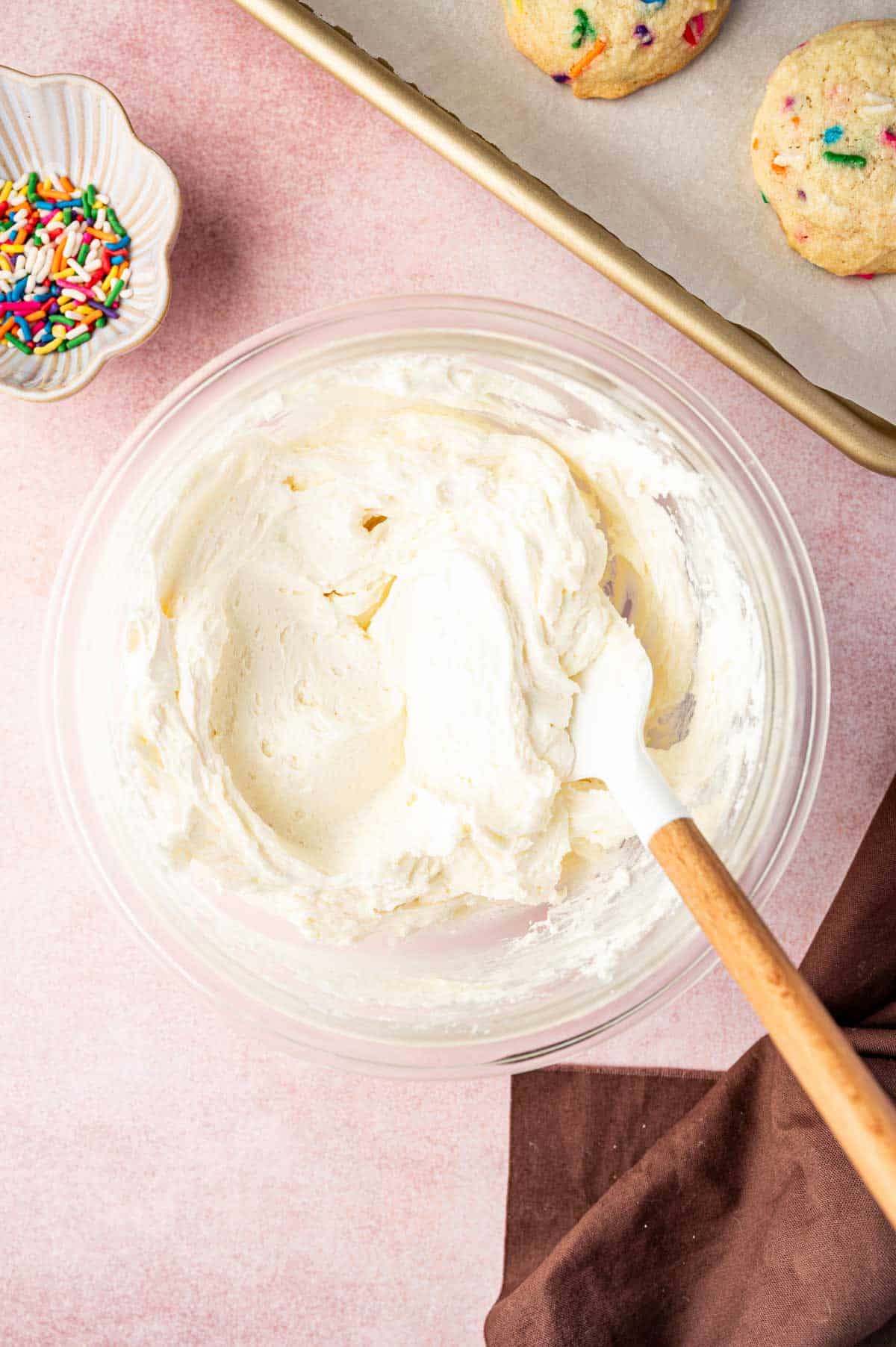 Buttercream frosting placed in a mixing bowl.