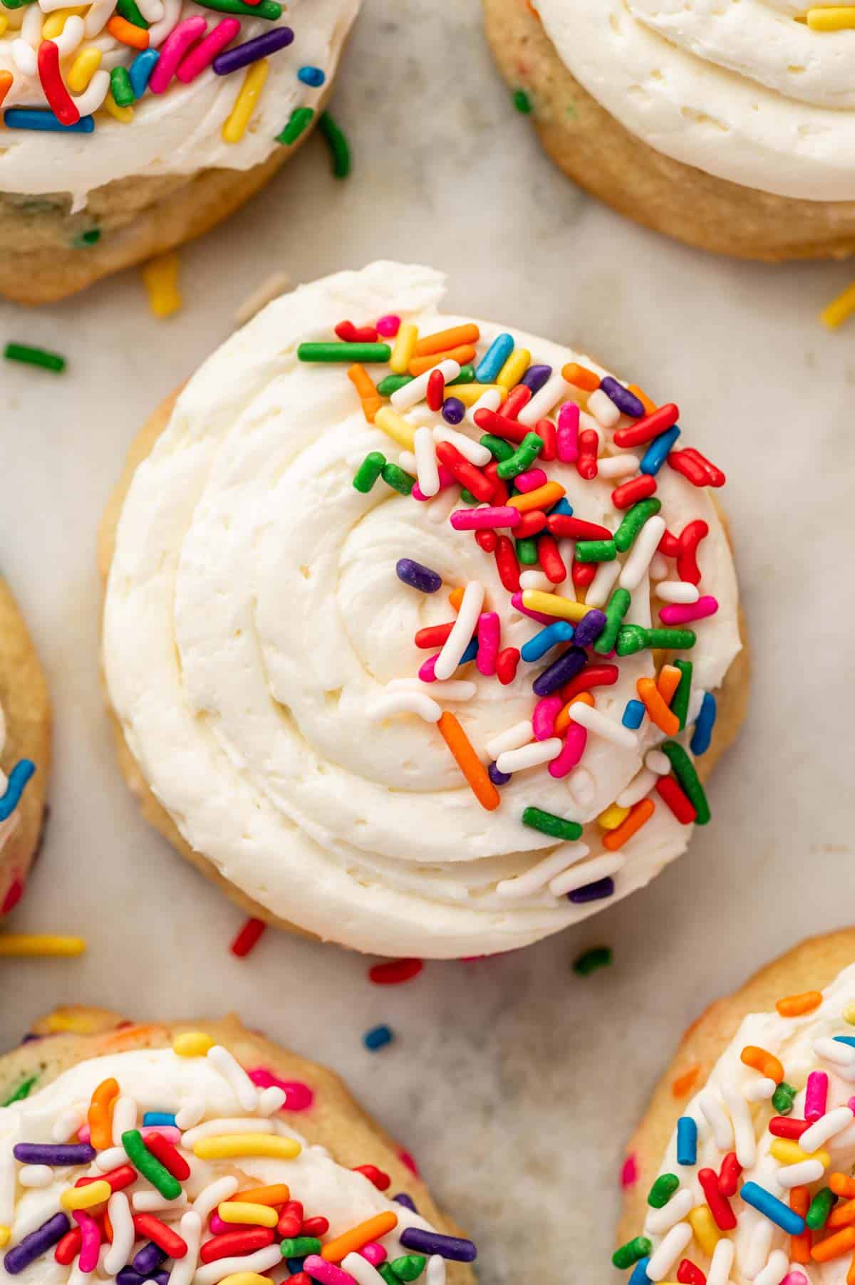 Single funfetti cookie with piped rosette buttercream and rainbow sprinkles