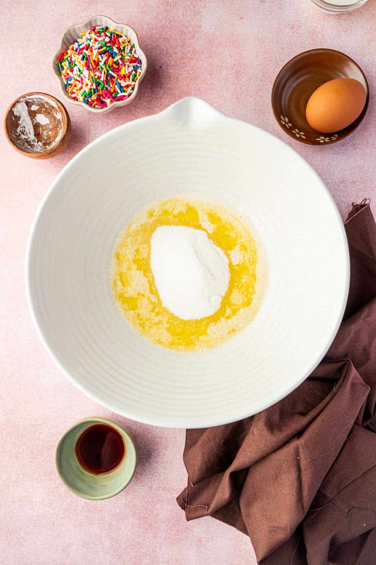 Butter and sugar creamed in bowl for funfetti cookie dough.