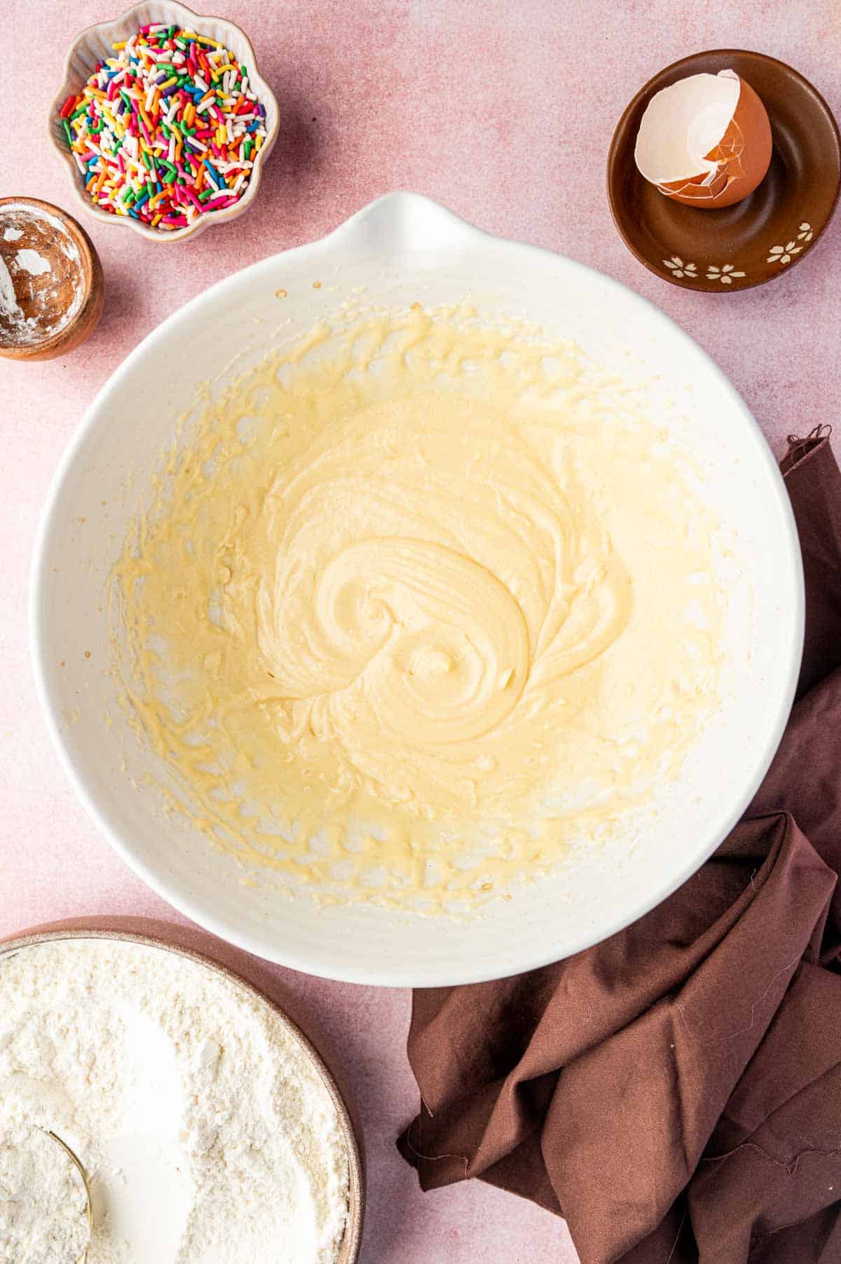 Butter and sugar creamed in bowl.