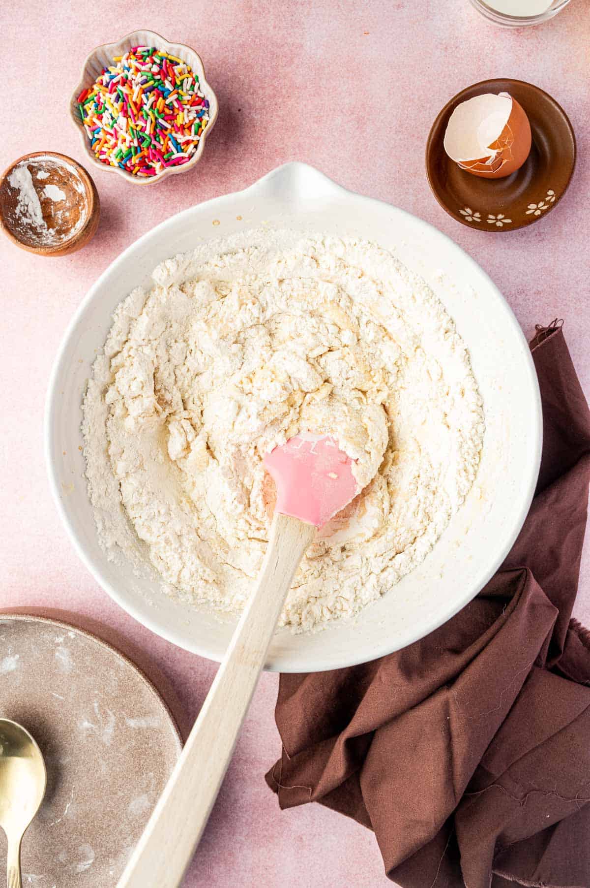 Dry ingredients being added to the wet ingredients.