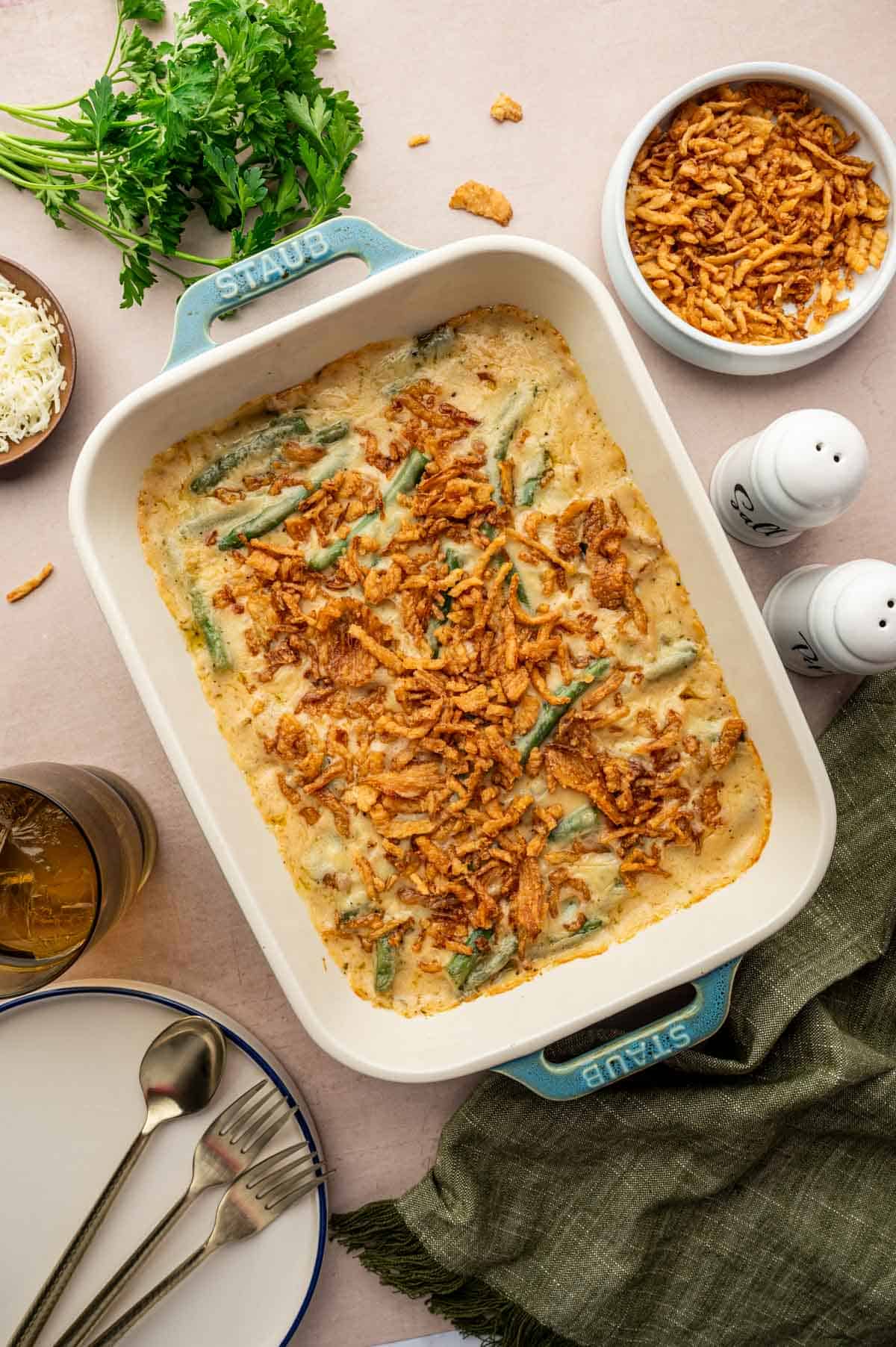 homemade cheesy green bean casserole with creamy sauce and melted cheese, baked to perfection.