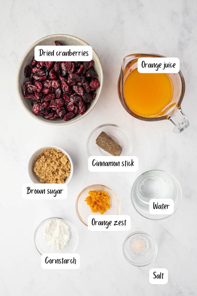ingredients laid out for Easy holiday sauce made from basic ingredients for cranberry sauce.
