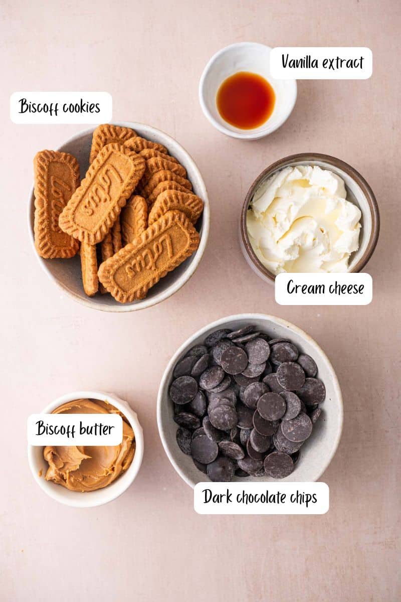 Overhead shot of homemade Biscoff truffles ingredients arranged on a warm background.