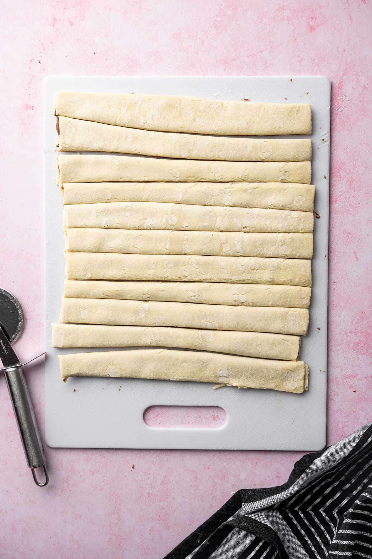 Sliced Nutella puff pastry swirl showing buttery pastry layers and melted chocolate hazelnut spread.