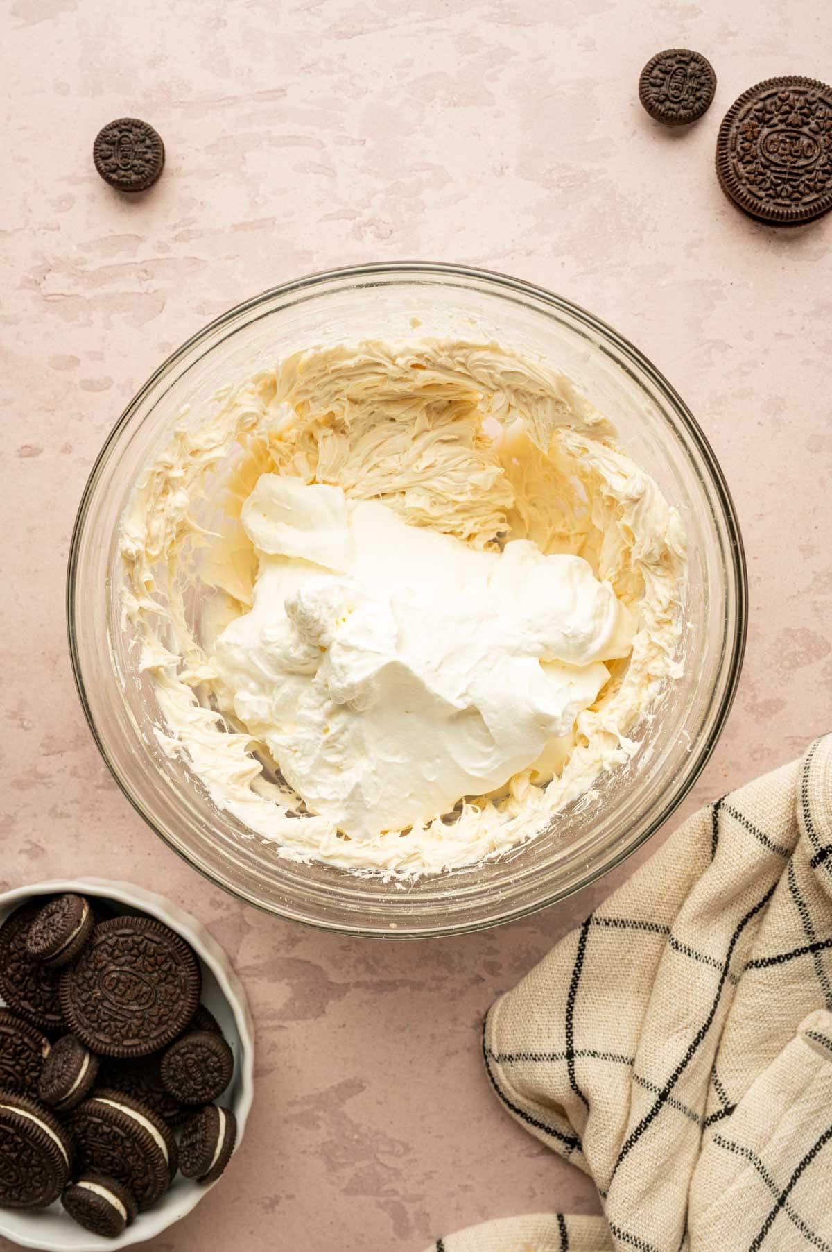 Whipped cream being folded into Oreo mousse mixture