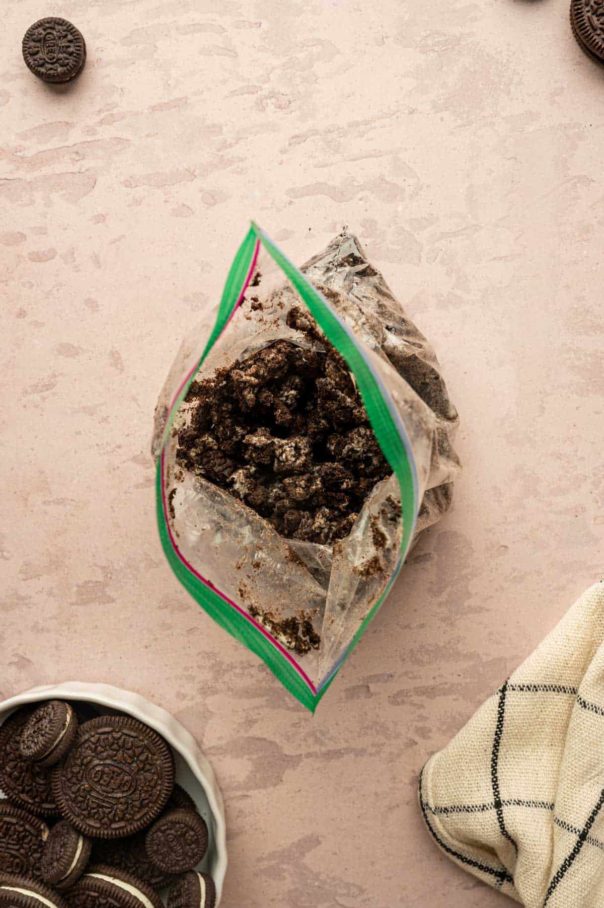 Crushed oreos in a ziplock bag.