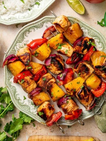 Juicy grilled chicken and pineapple skewers with colorful vegetables