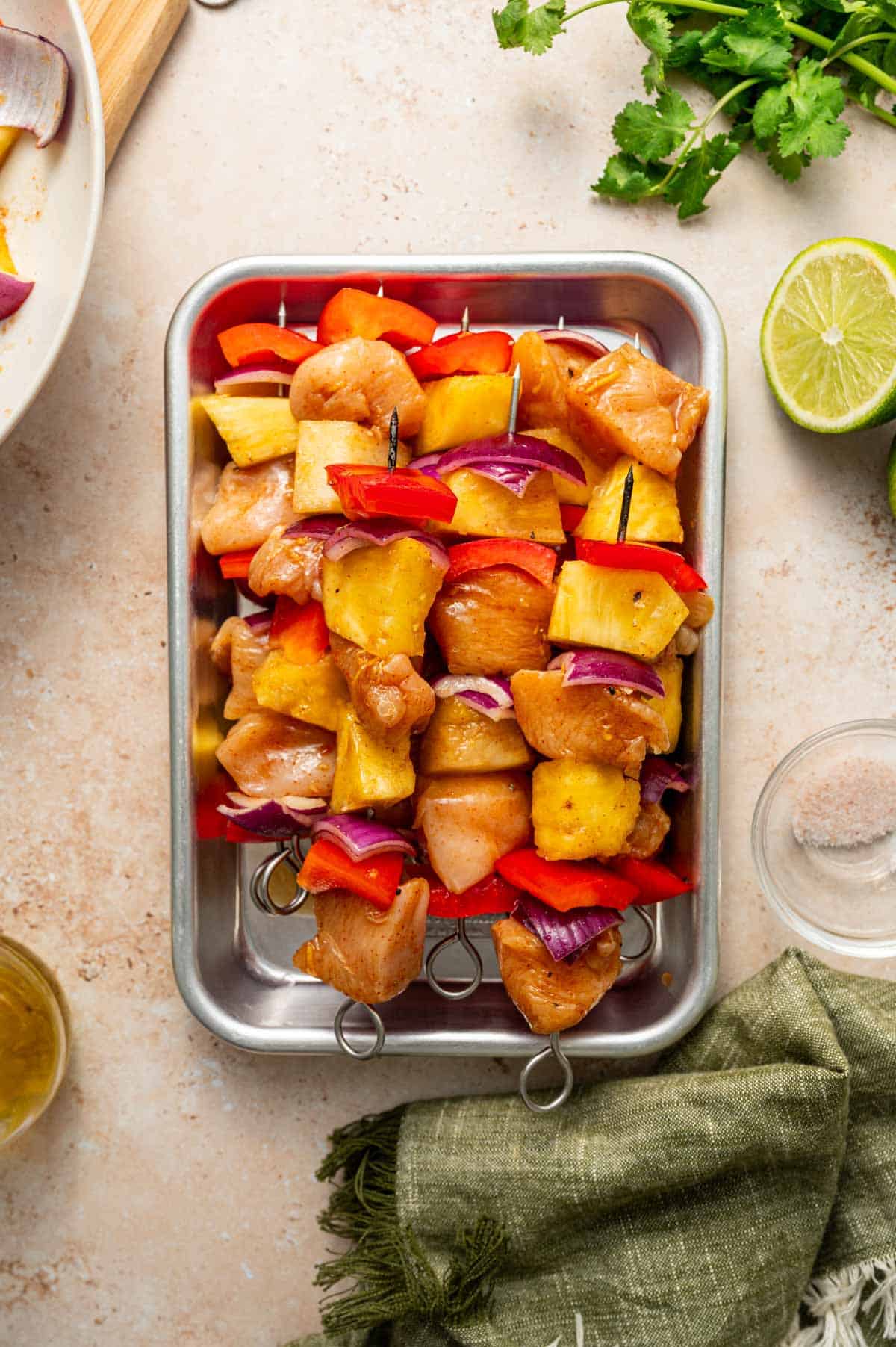 Marinated chicken and pineapple skewers ready for grilling
