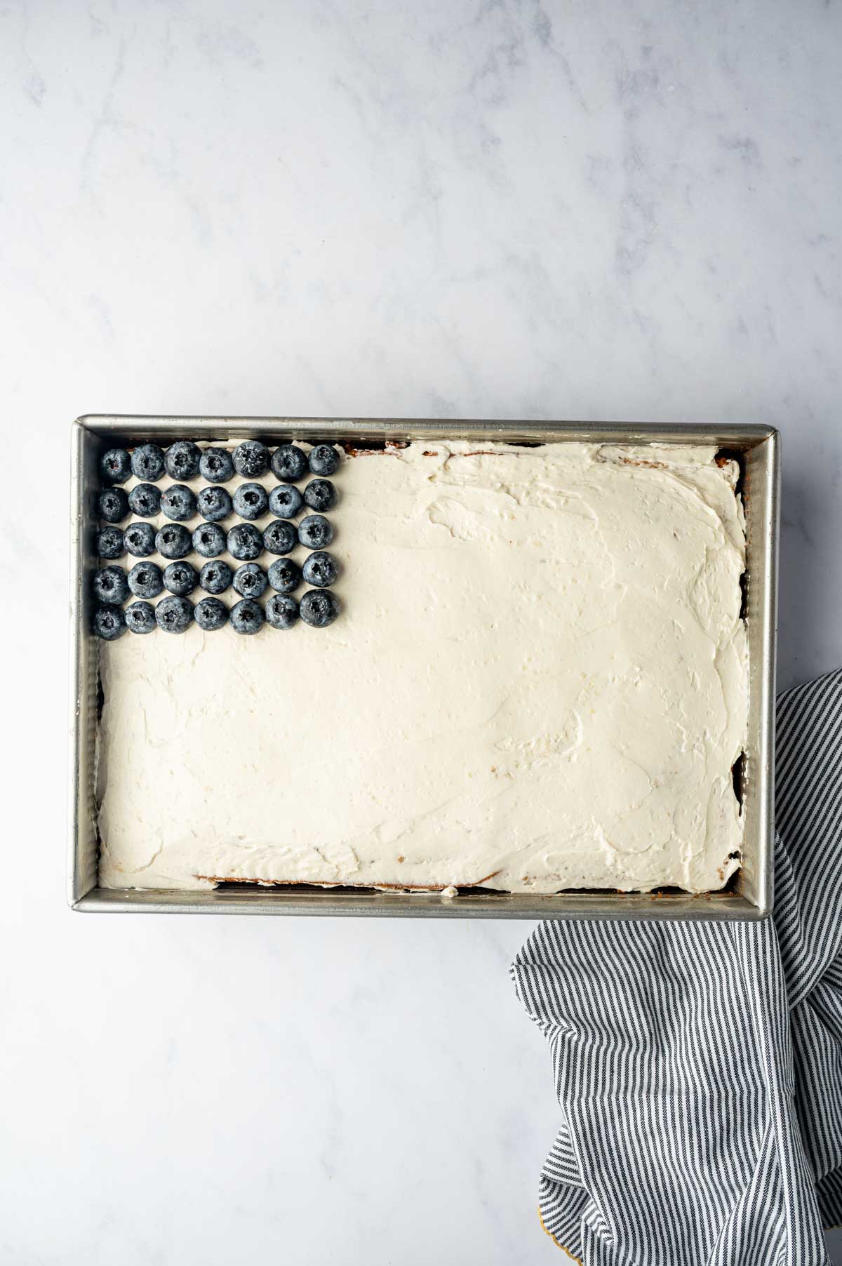 Blueberries being arranges on top left to resemble ble color in the American Flag