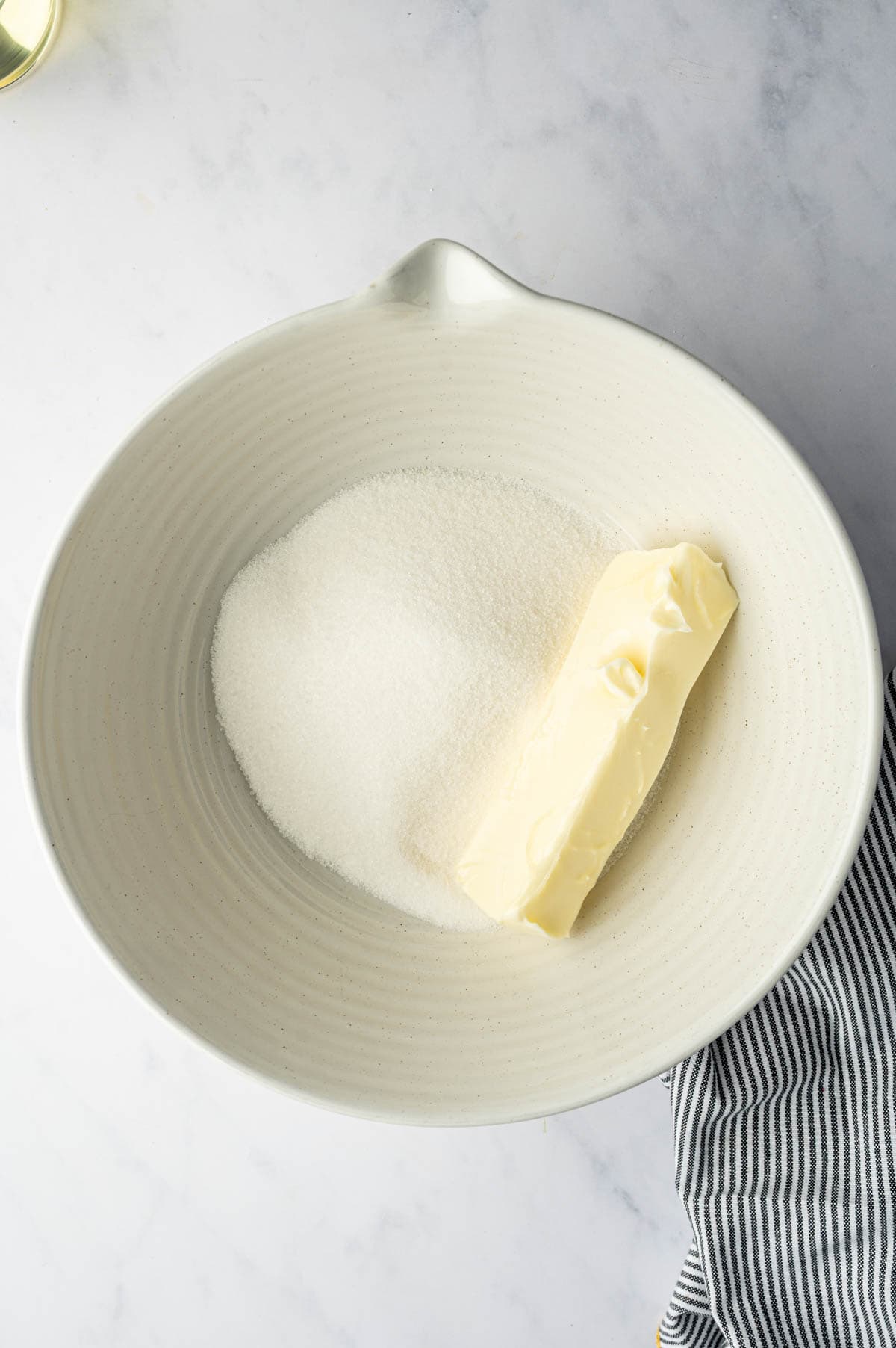 In a bowl butter and sugar combined.