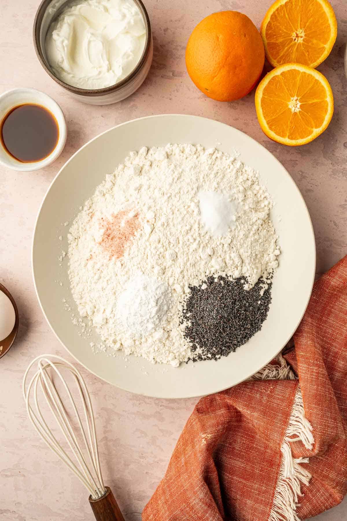 Dry ingredients being added to a mixing bowl.