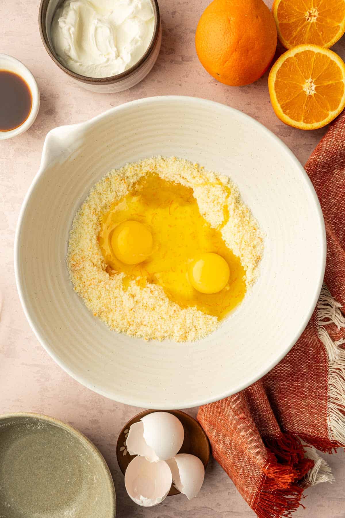 Wet ingredients being mixed for making orange muffins