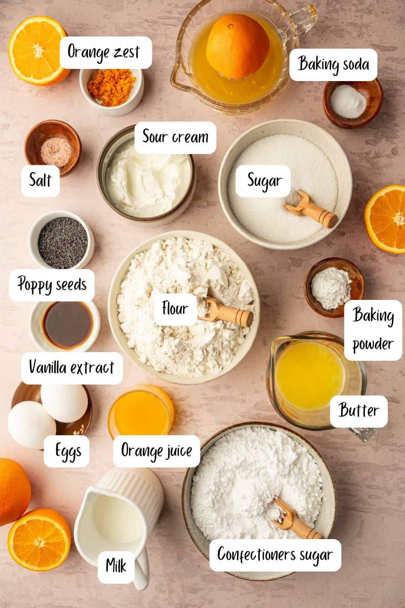 Top-down view of orange poppy seed muffins ingredients laid out.