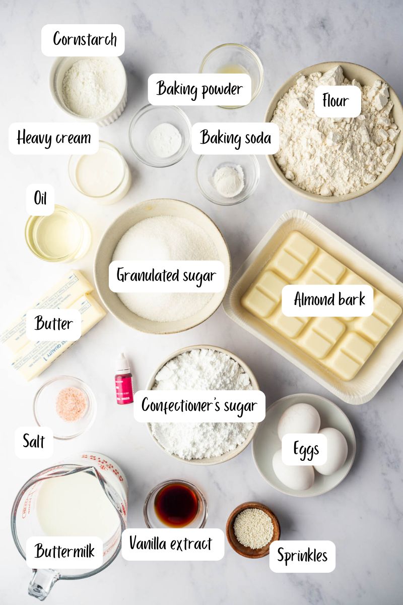 Ingredients for homemade birthday cake pops including cake mix, frosting, and candy melts
