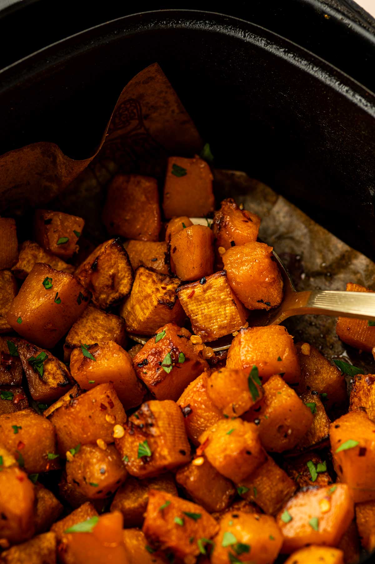 Air Fryer Butternut Squash made with maple syrup, cinnamon, and red pepper flakes.
