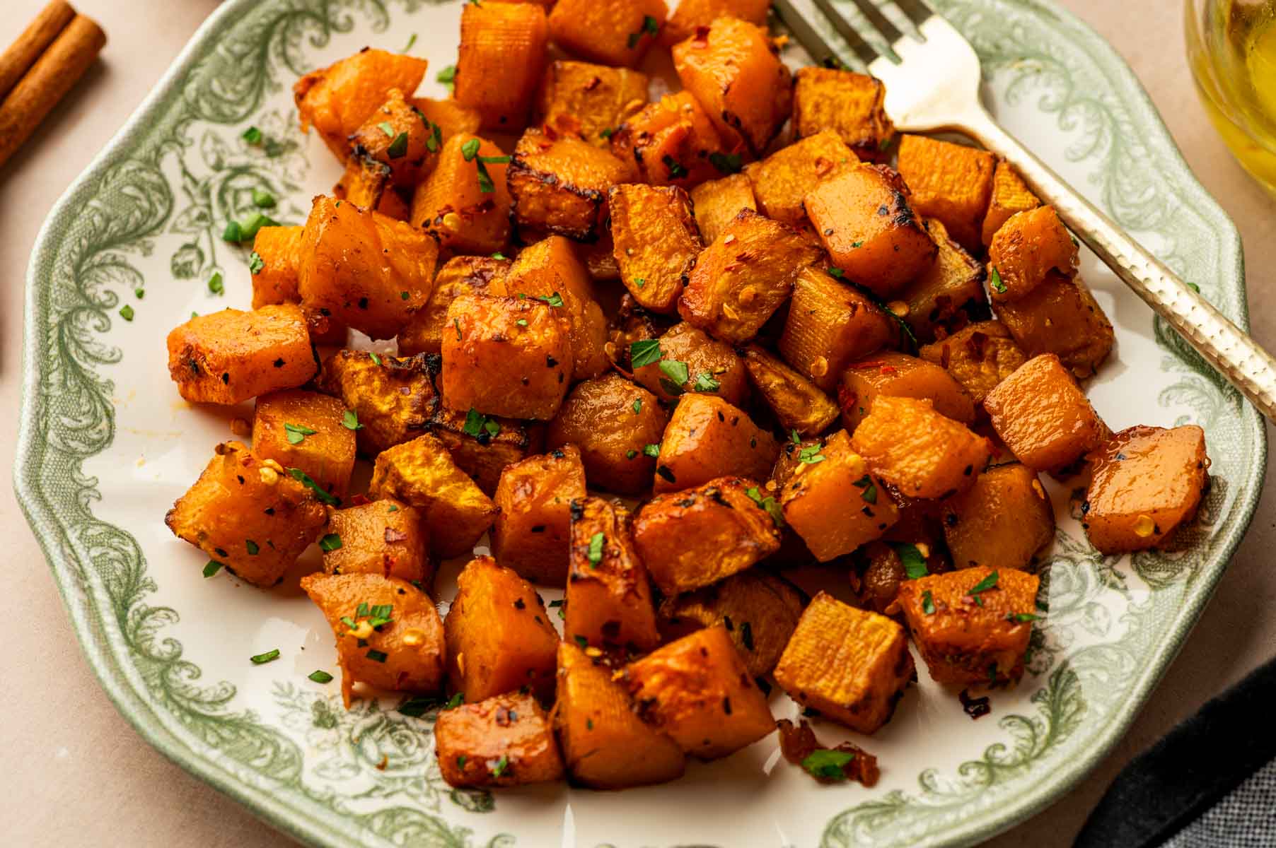 Crispy Air Fryer Butternut Squash cubes in a serving plate ready for dinner.