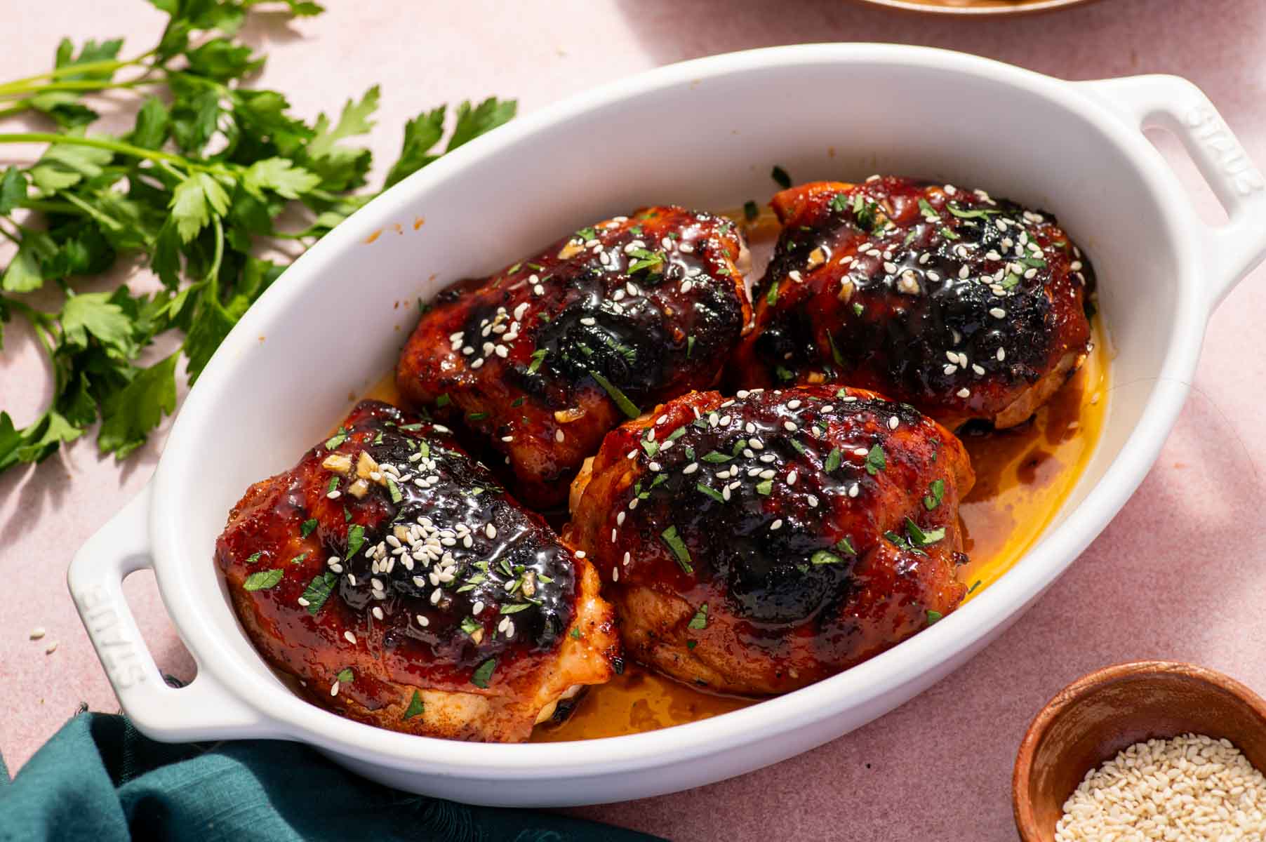 Honey garlic sauce drizzled over baked chicken thighs