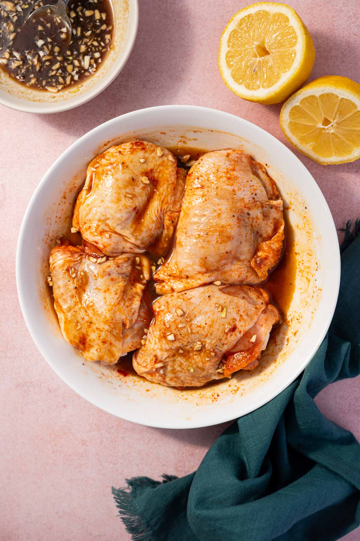 Coating chicken thighs with honey garlic sauce