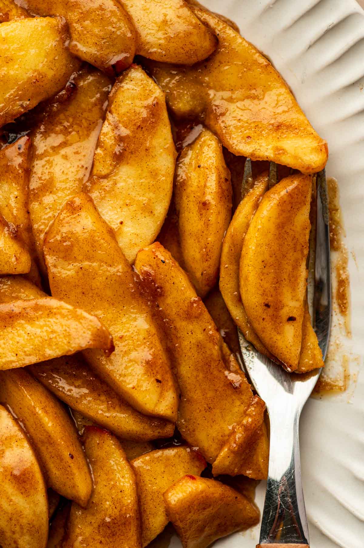 Tender cinnamon air fryer apples served warm in a plate
