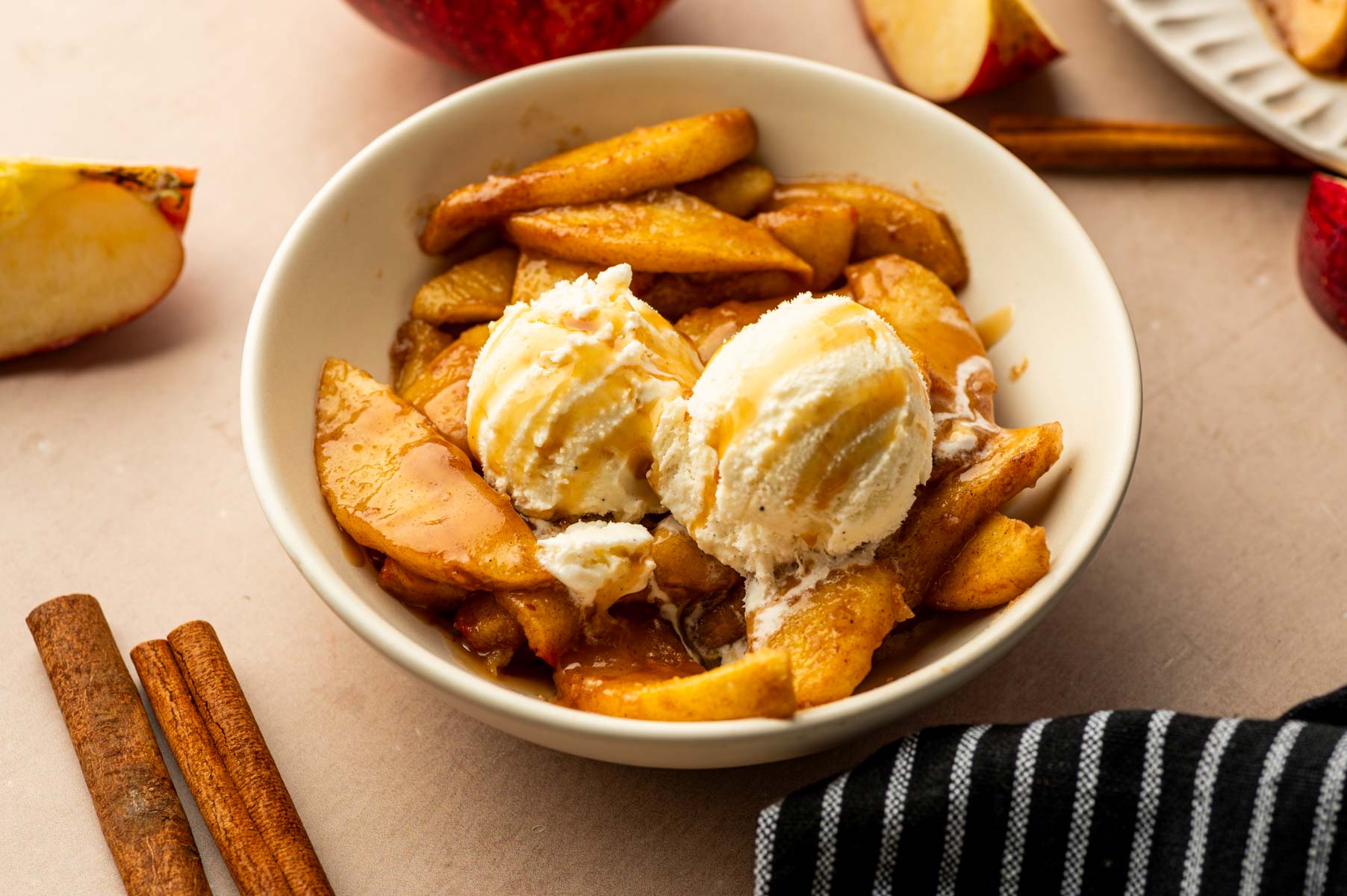 Air fried apples and ice cream in a bowl.