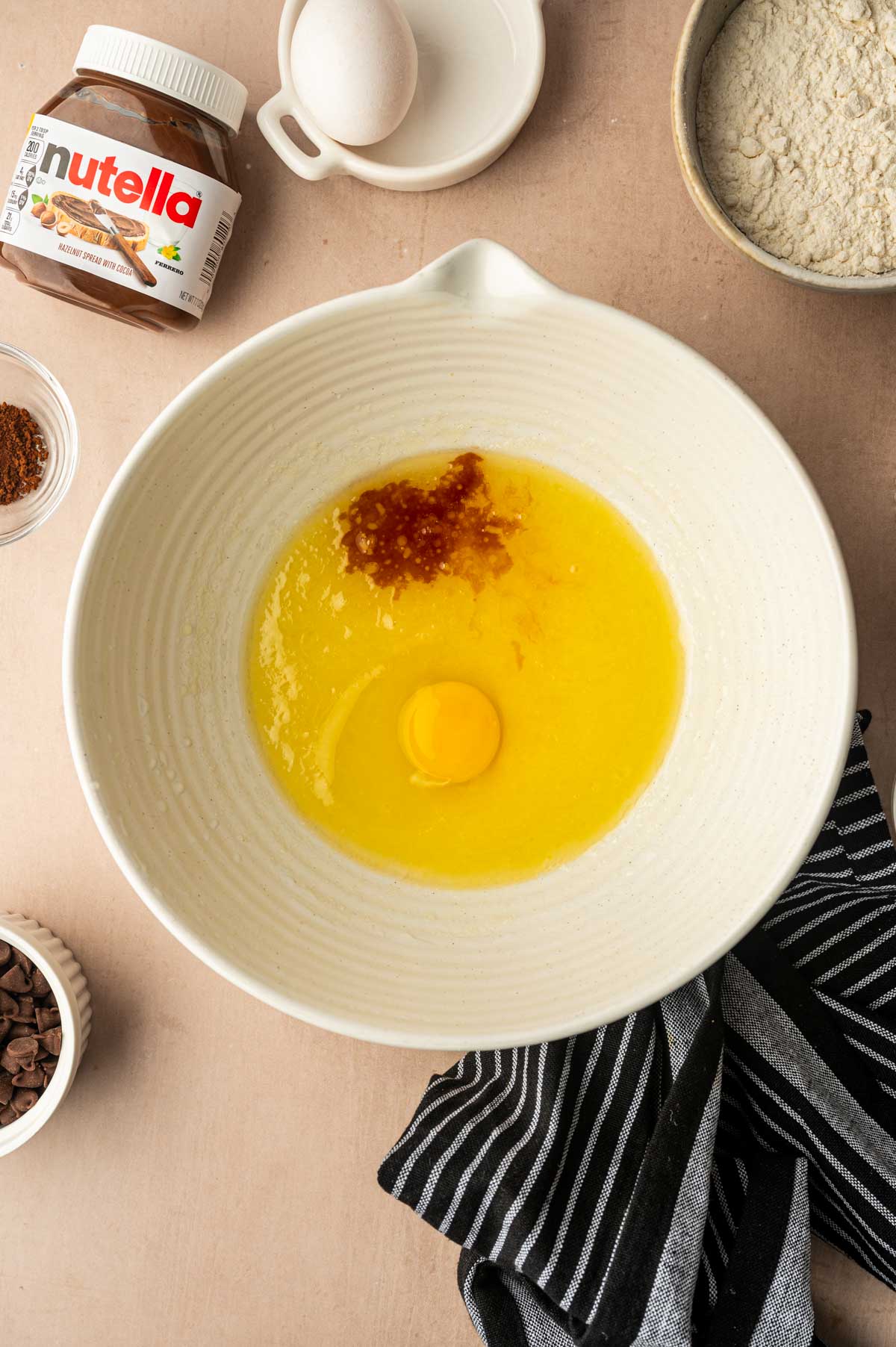 Egg and vanilla extract added to the wet micture.