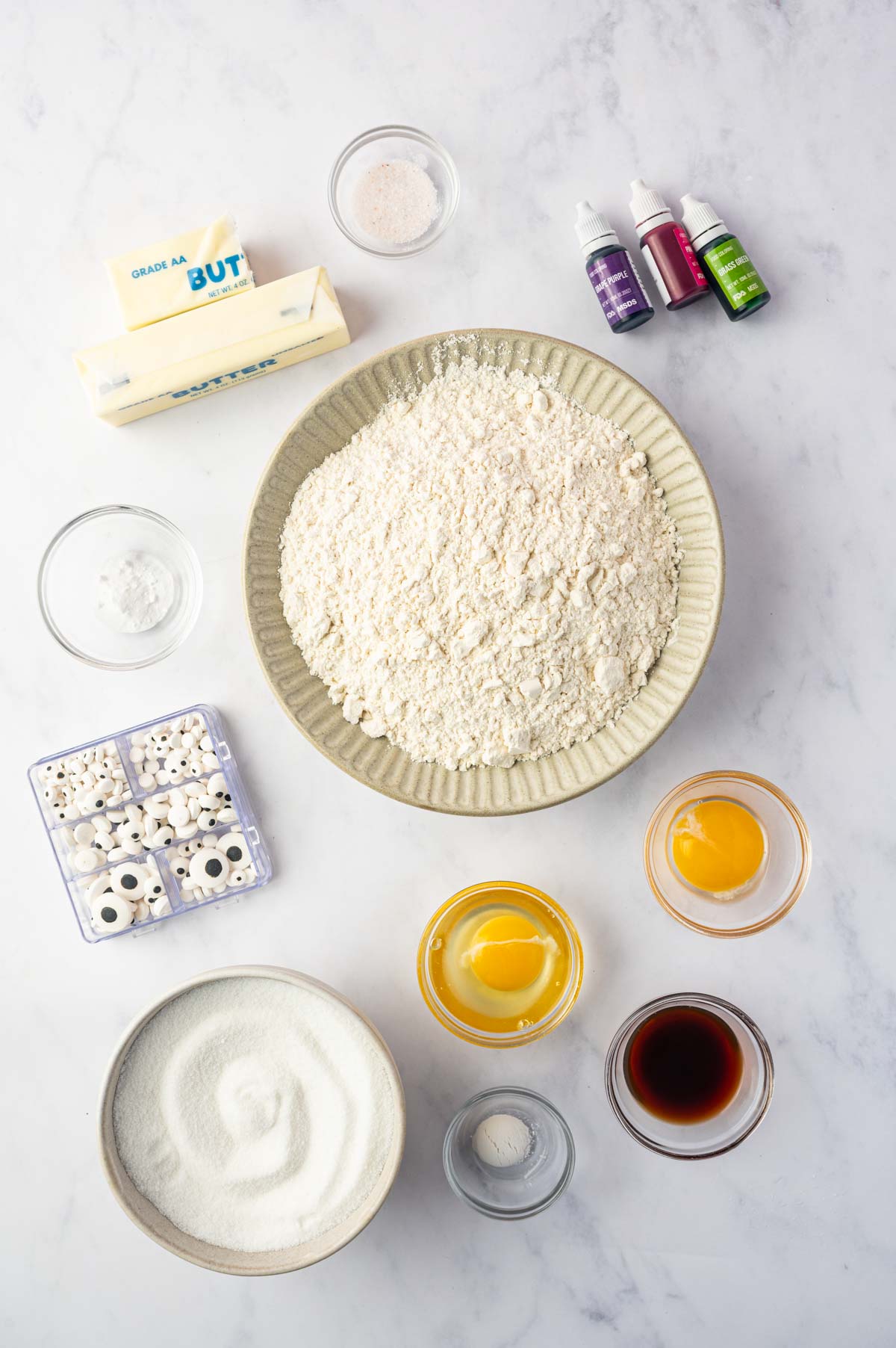 Ingredients laid out for making Halloween Monster Eye Cookies with edible candy eyes.