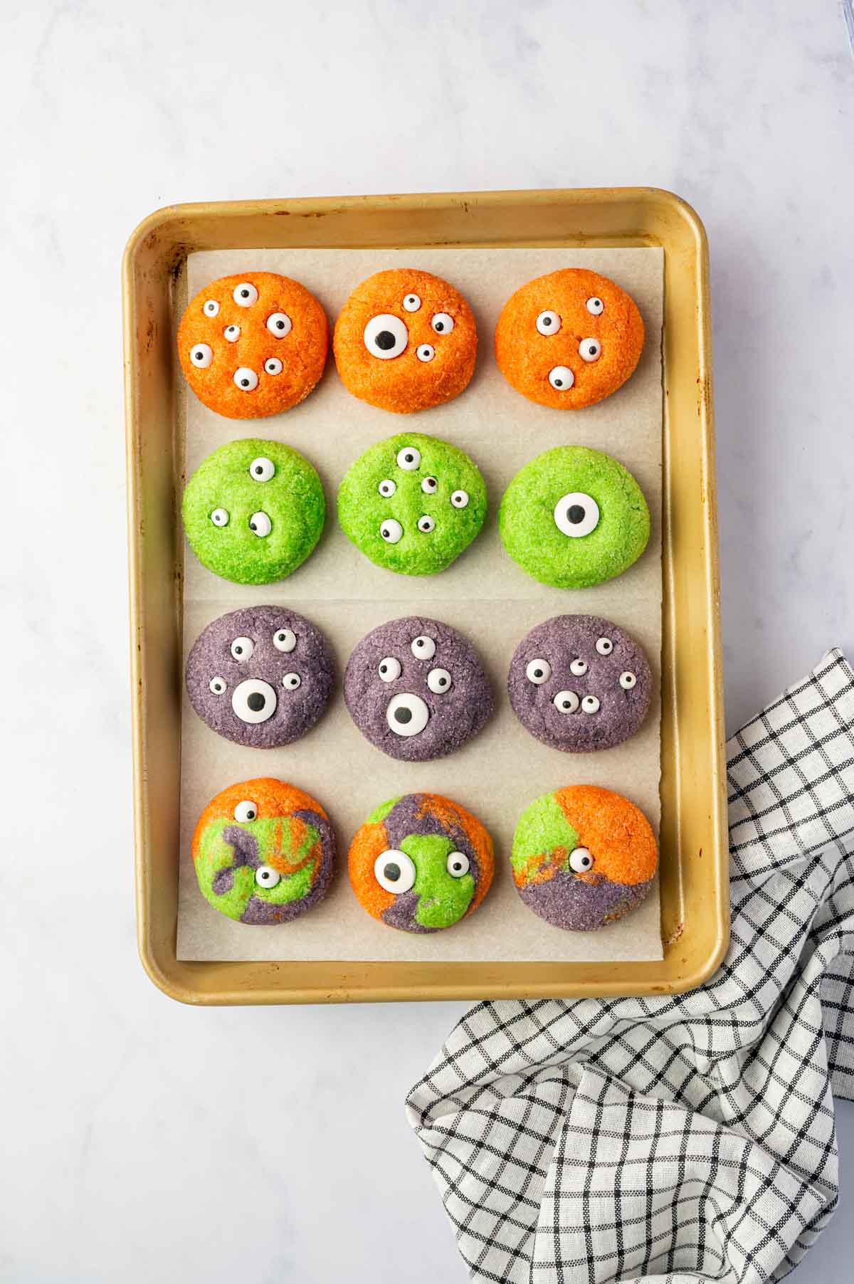 Green , Orange Purple Halloween Monster Eye Cookies topped with assorted candy eyes