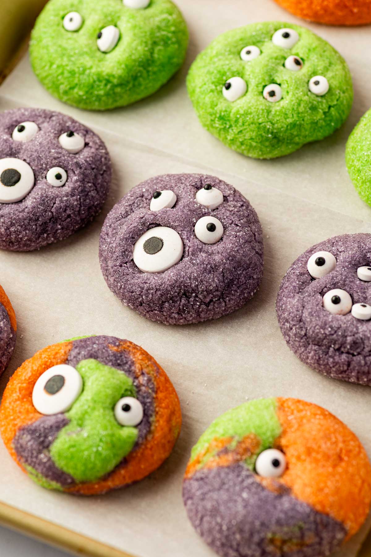 Soft Halloween Monster Eye Cookies rolled in sugar and decorated with edible eyes