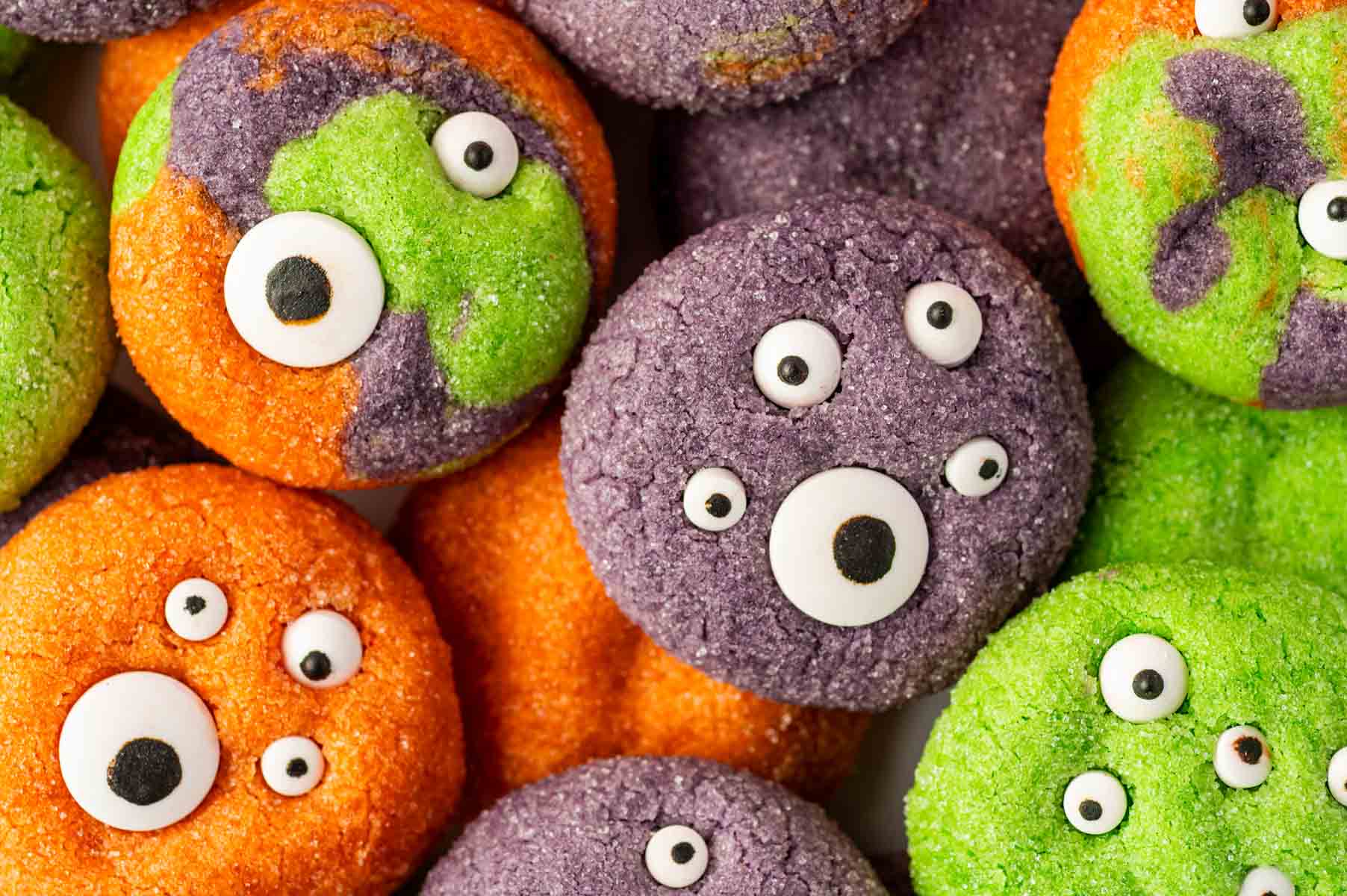 Easy Halloween Monster Eye Cookies made with purple, orange, and green cookie dough