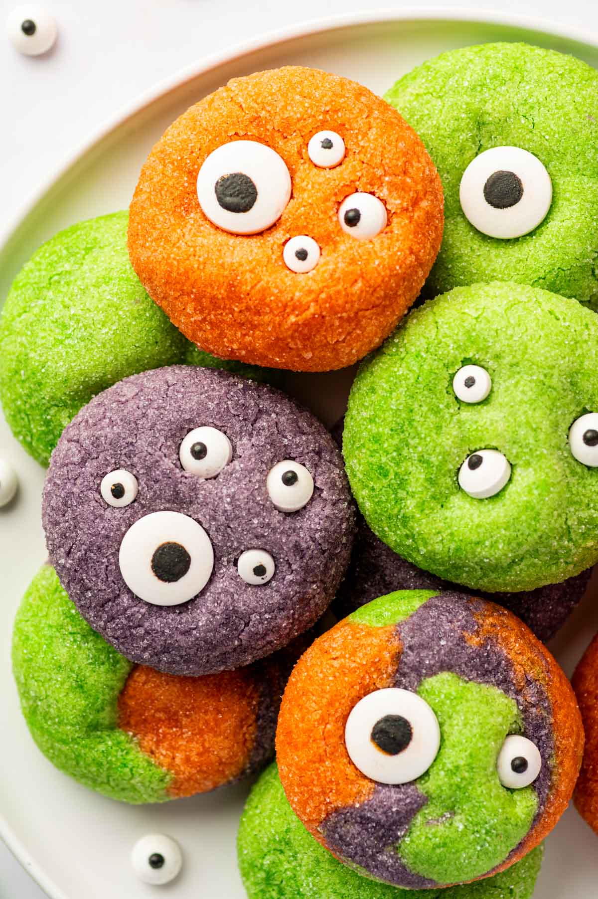 Orange Halloween Monster Eye Cookies decorated with edible candy eyes