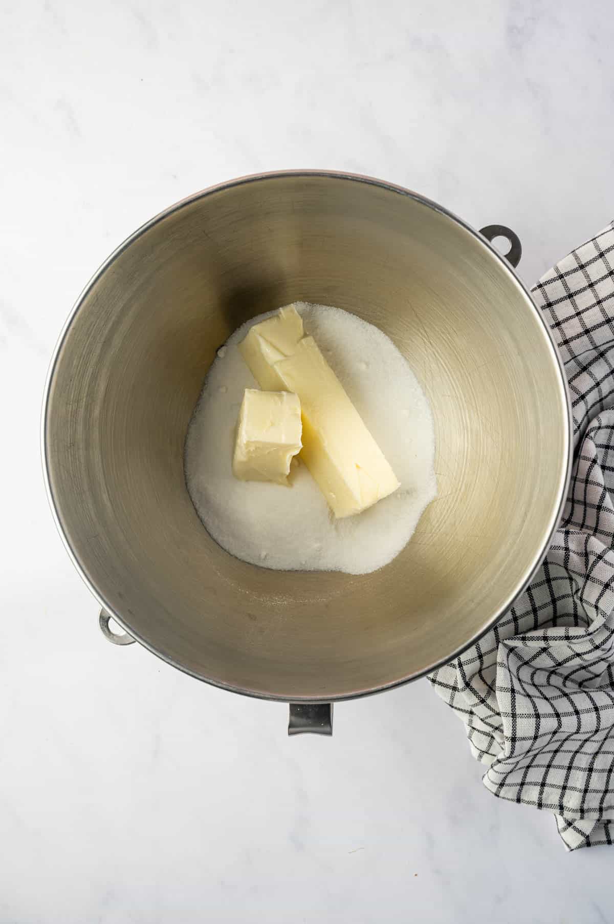Sugar and butter added to the mixing bowl.